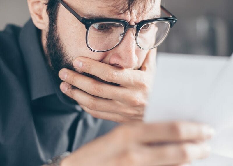 Man in Black Suit Jacket Wearing Black Framed Eyeglasses